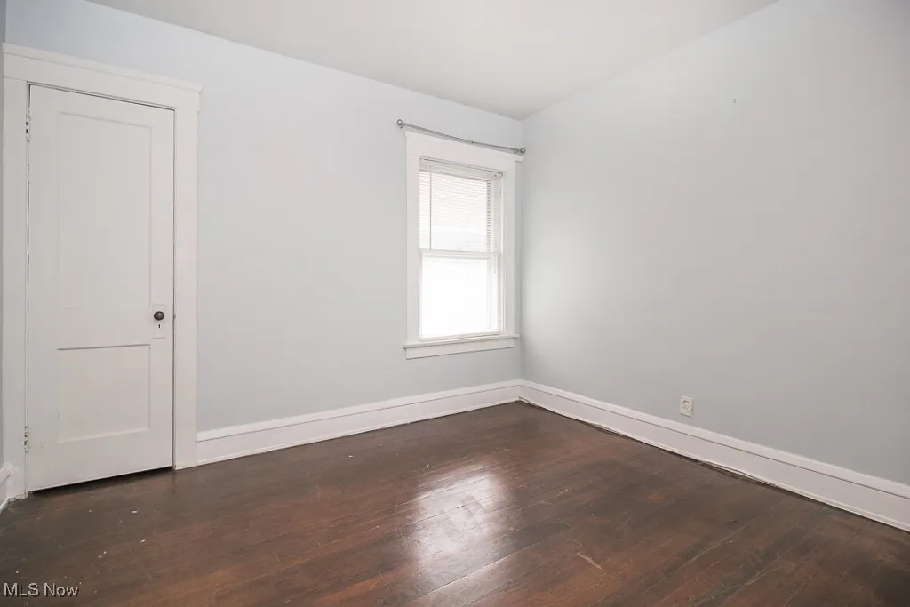 Unfurnished room featuring wood-type flooring