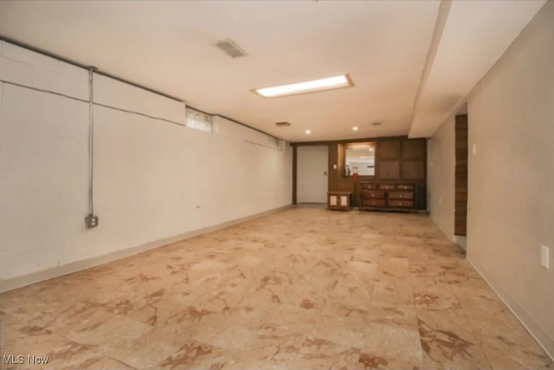 Basement featuring baseboards