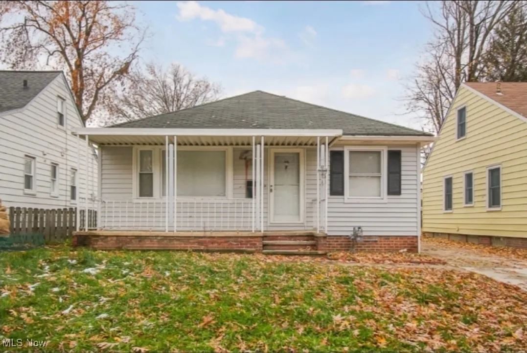 Bungalow with roof with shingles and covered porch