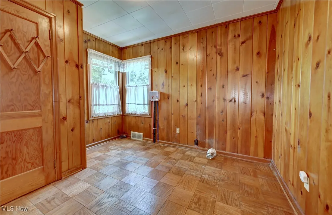 Spare room with wooden walls