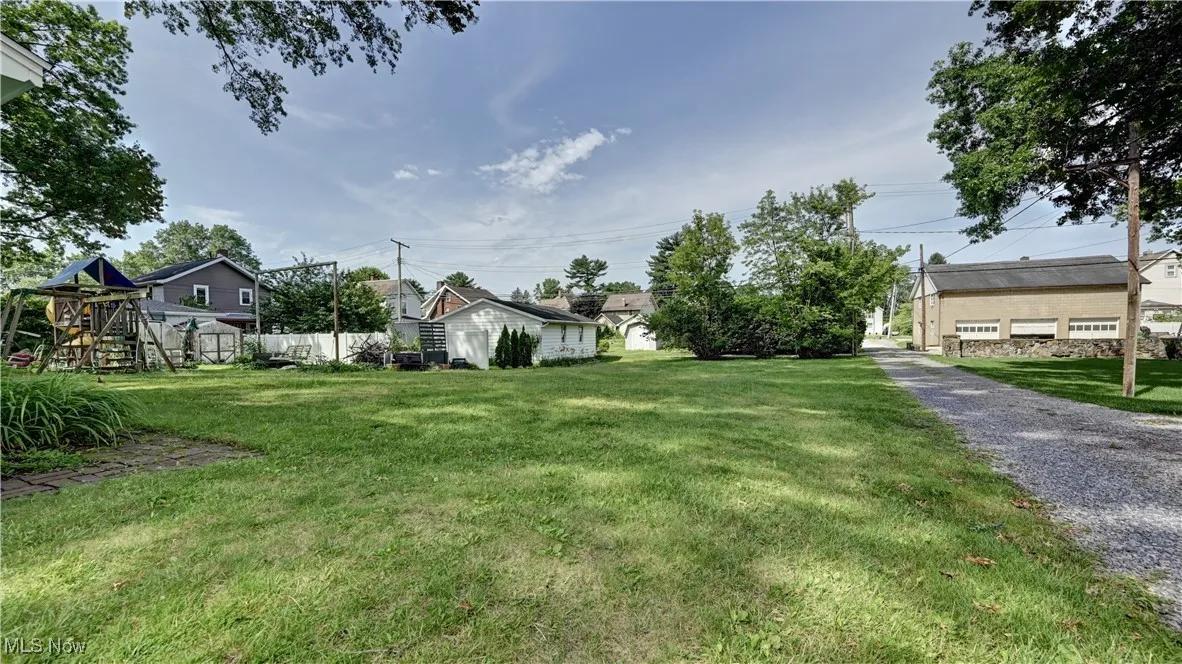 View of yard featuring a playground and a residential view