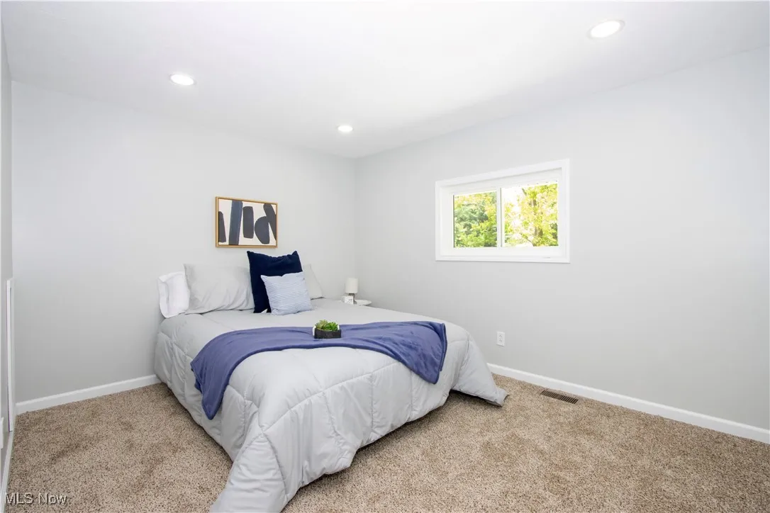 Bedroom featuring carpet floors and recessed lighting