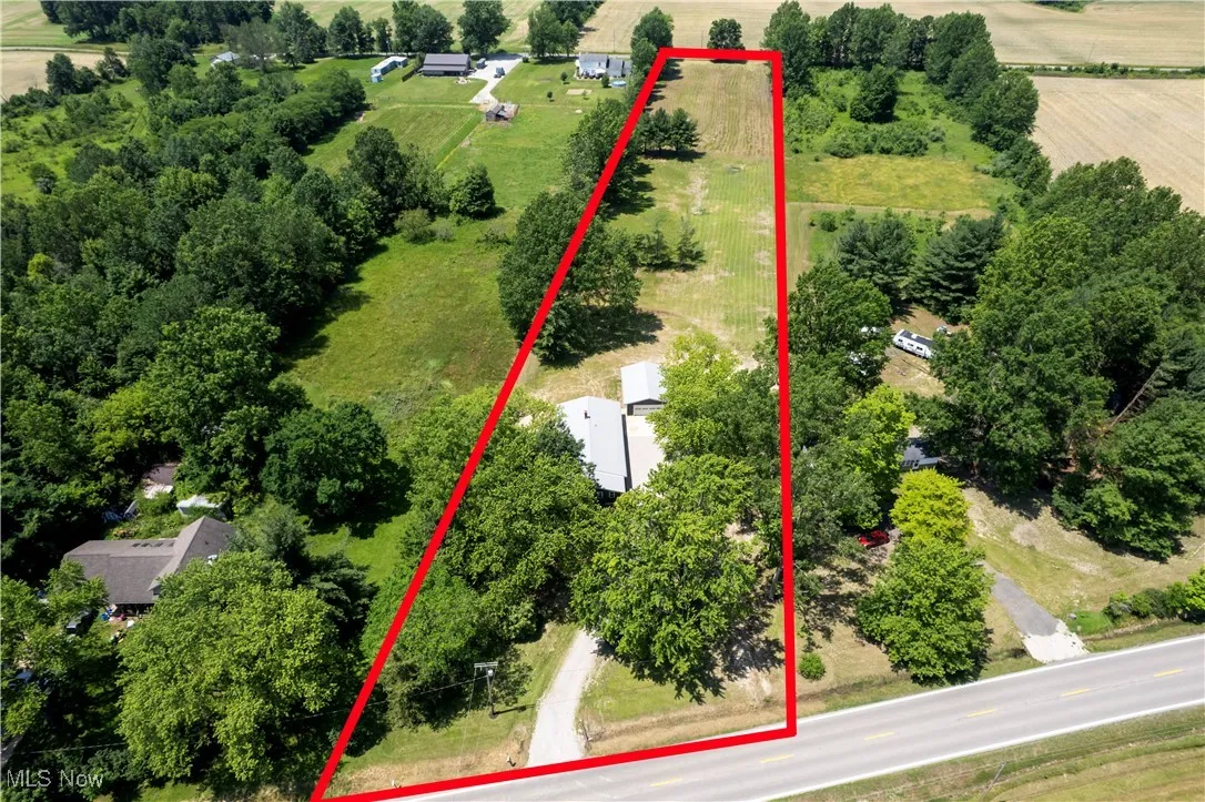 Aerial view of sparsely populated area with property boundaries highlighted