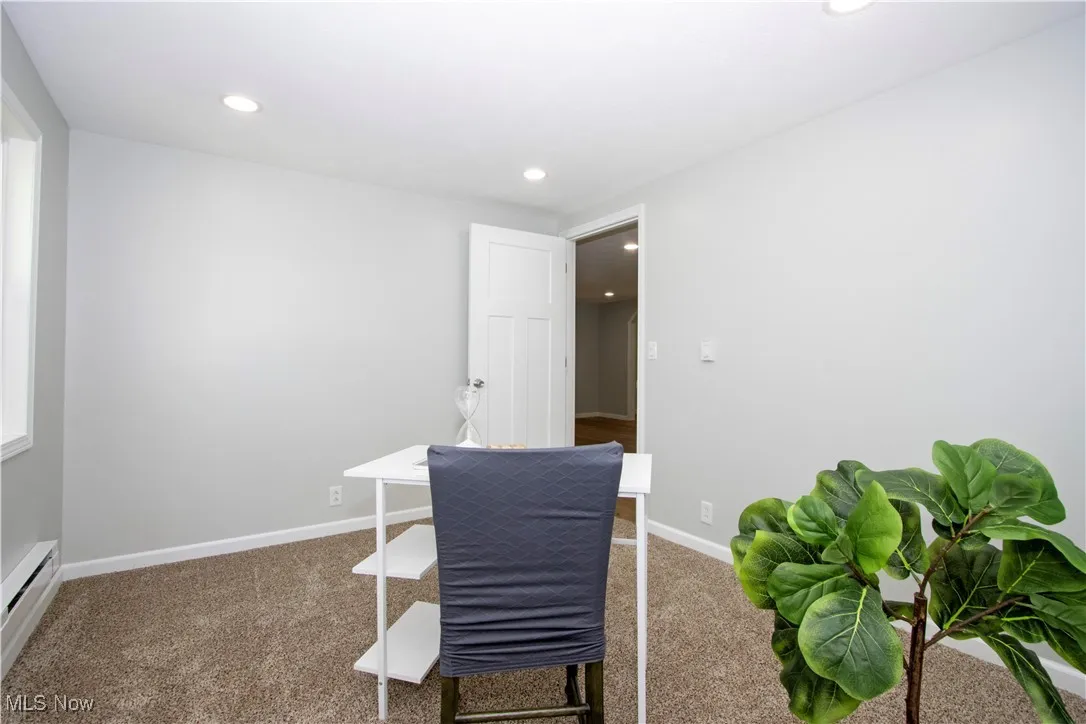 Office featuring baseboard heating, carpet, and recessed lighting