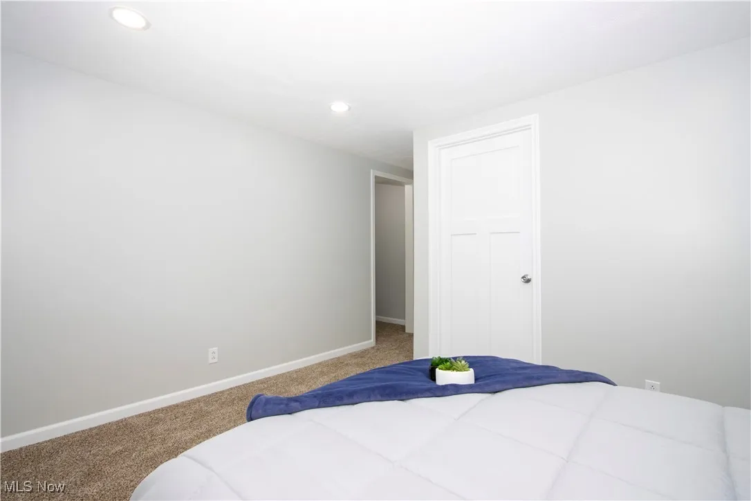 Bedroom with carpet and recessed lighting