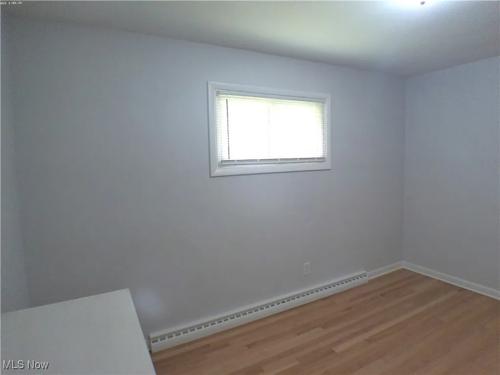  Primary bedroom with refinished Oak wood flooring