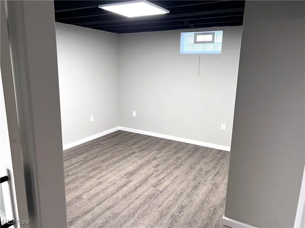LL bedroom 4 with VLT wood floors and baseboards