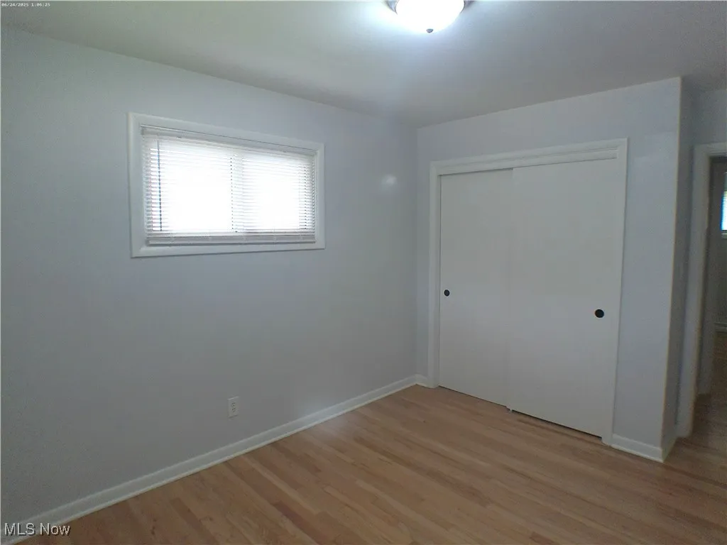  Bedroom 2 with refinished Oak wood flooring and a closet