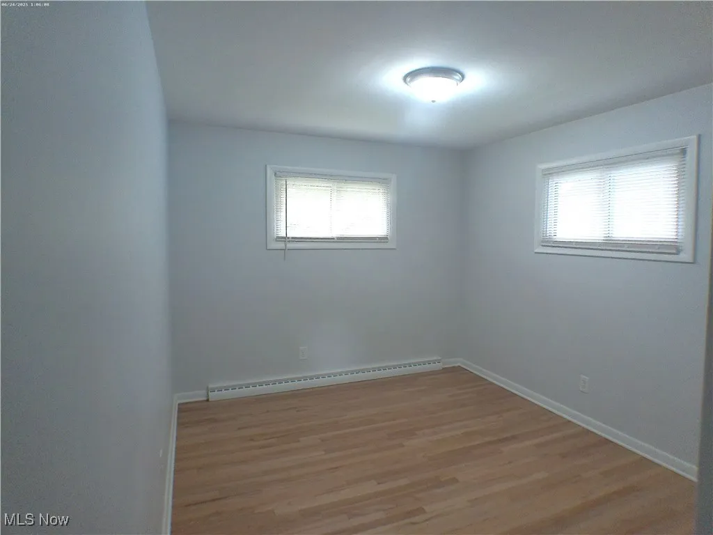 Bedroom 2 with light Oak wood refinished floors