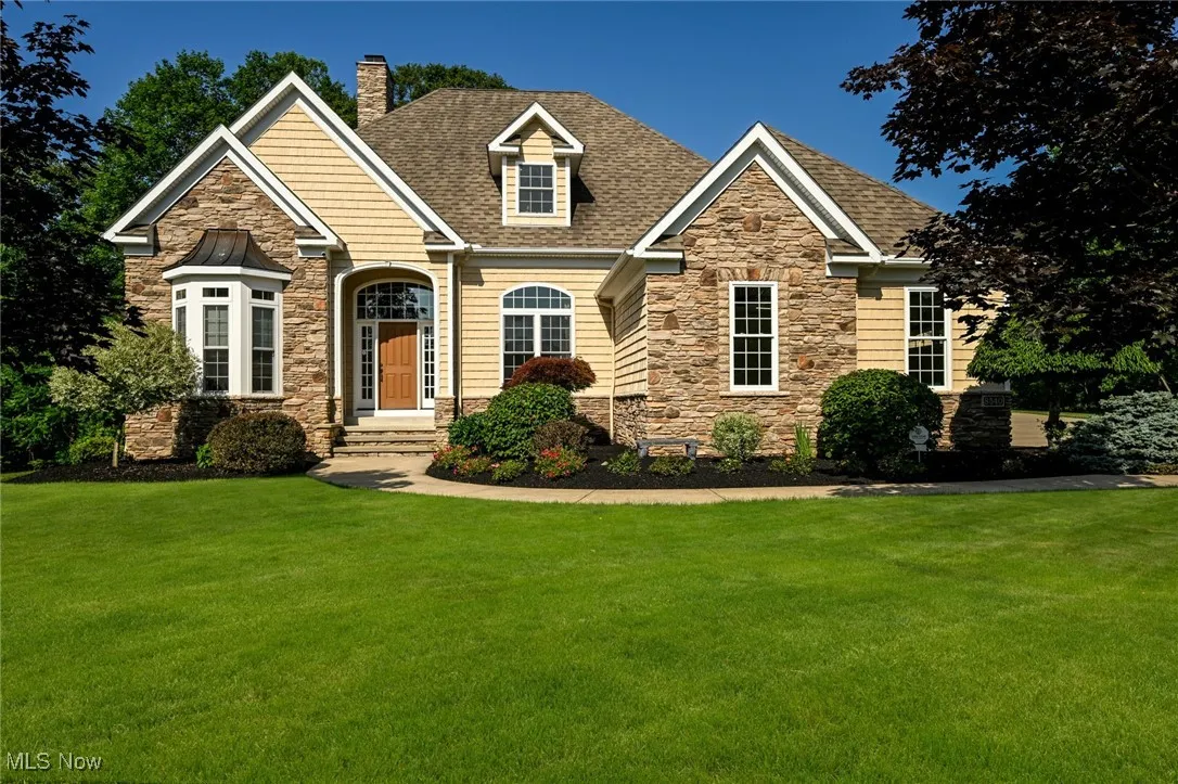 Front of home with nice landscaping.