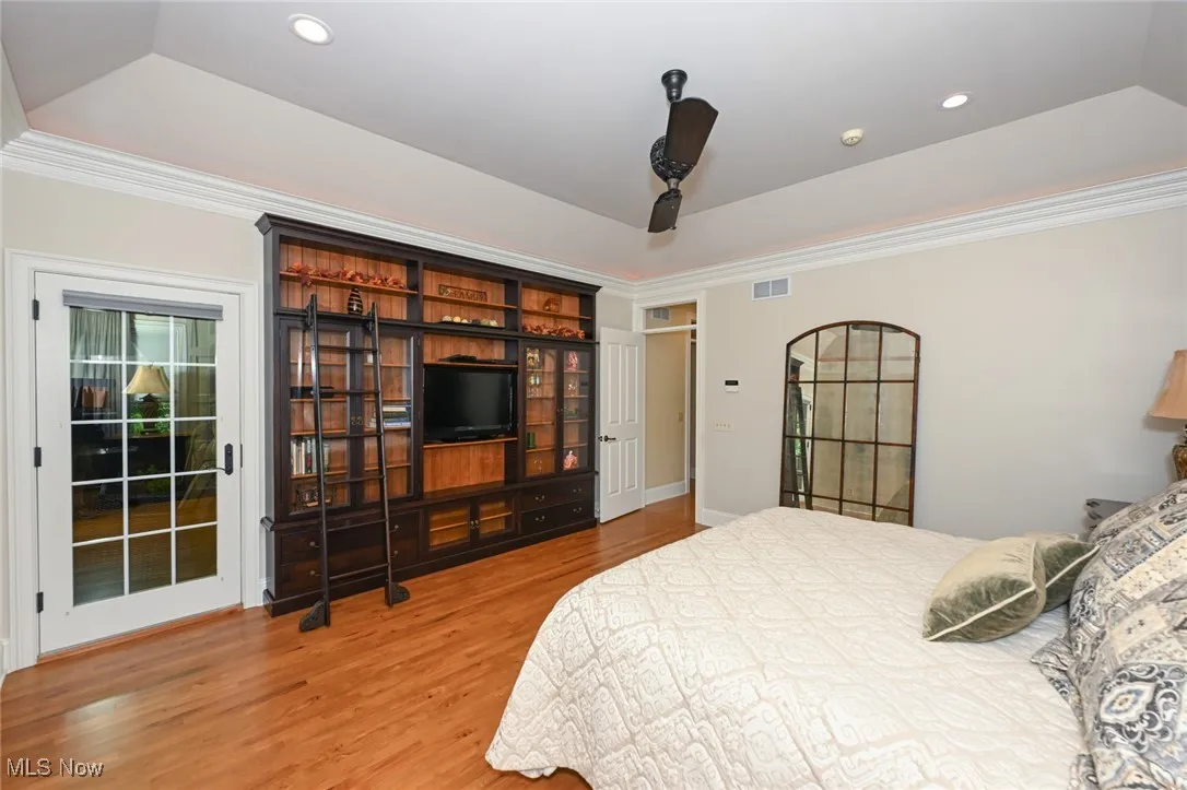 Primary bedroom with black walnut built ins.