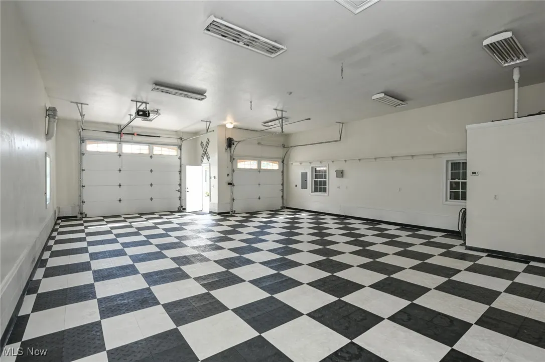 Additional garage area and half bath.