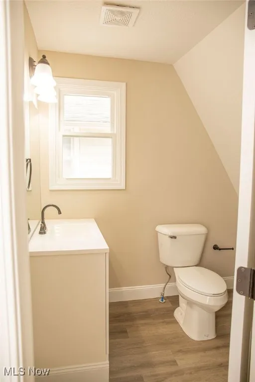 Bathroom featuring wood finished floors and vanity