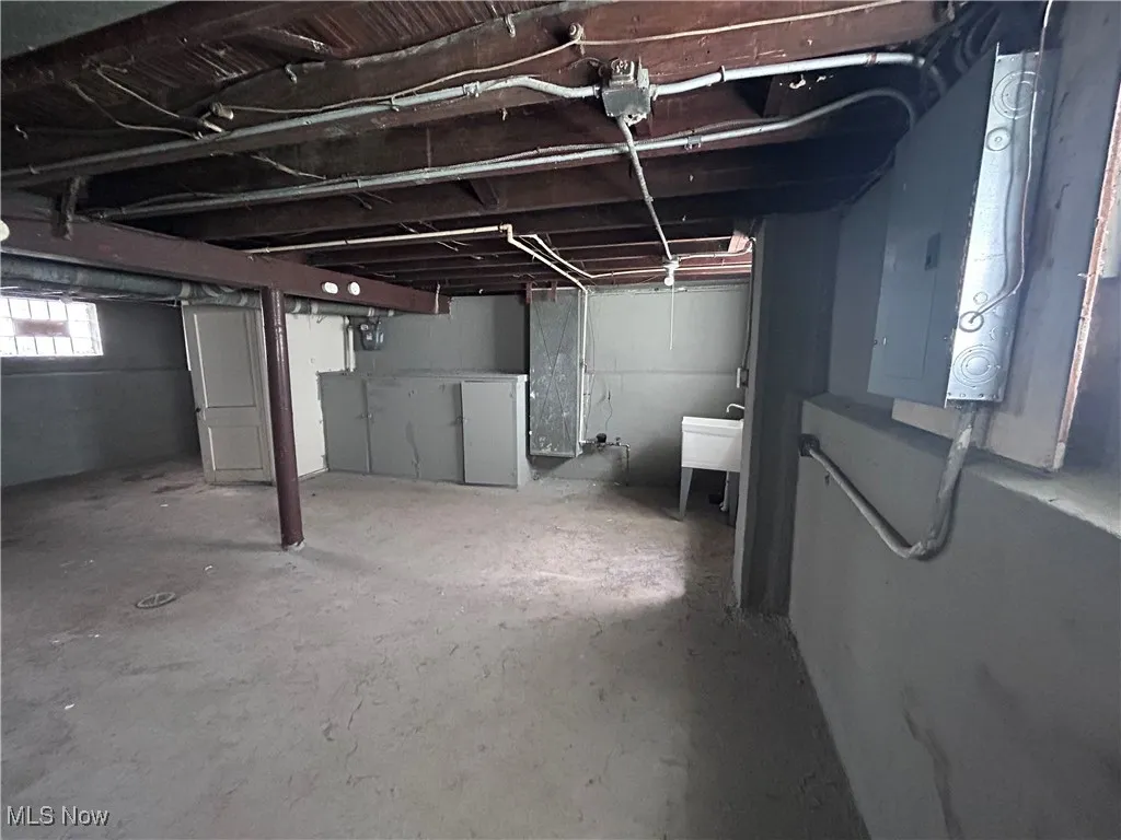 Basement featuring electric panel