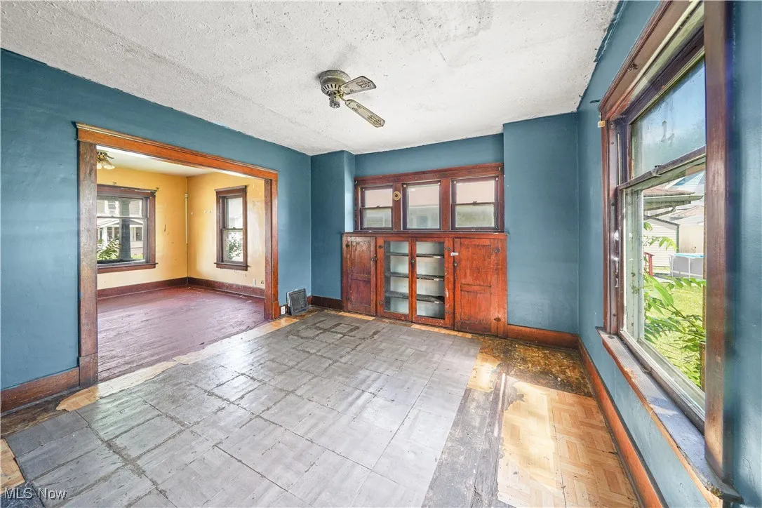 Empty room featuring baseboards and a textured ceiling