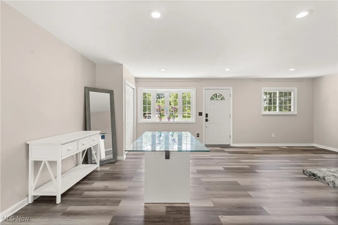 Entrance foyer featuring healthy amount of natural light, recessed lighting, and wood finished floors