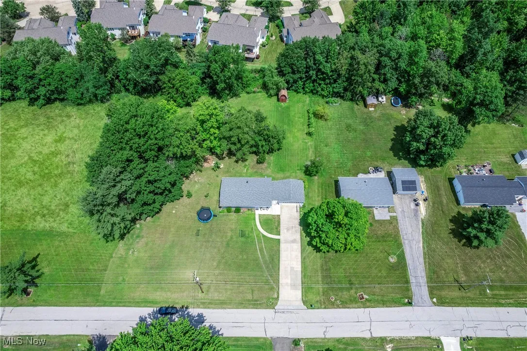Aerial overview of property's location with nearby suburban area