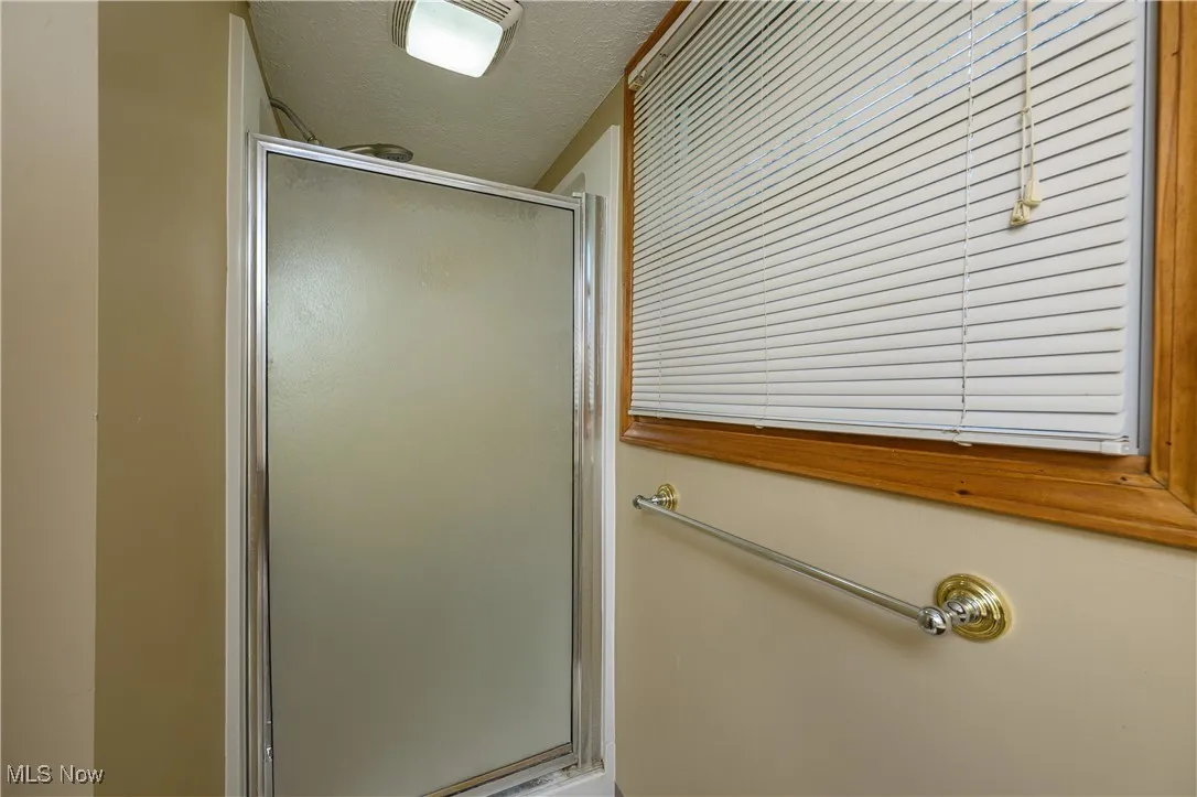 Bathroom featuring a shower stall