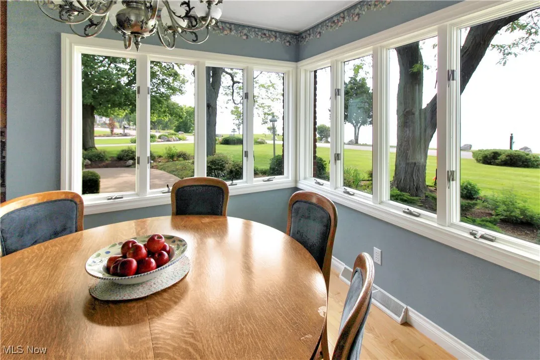 Dining space with a chandelier and wood finished floors