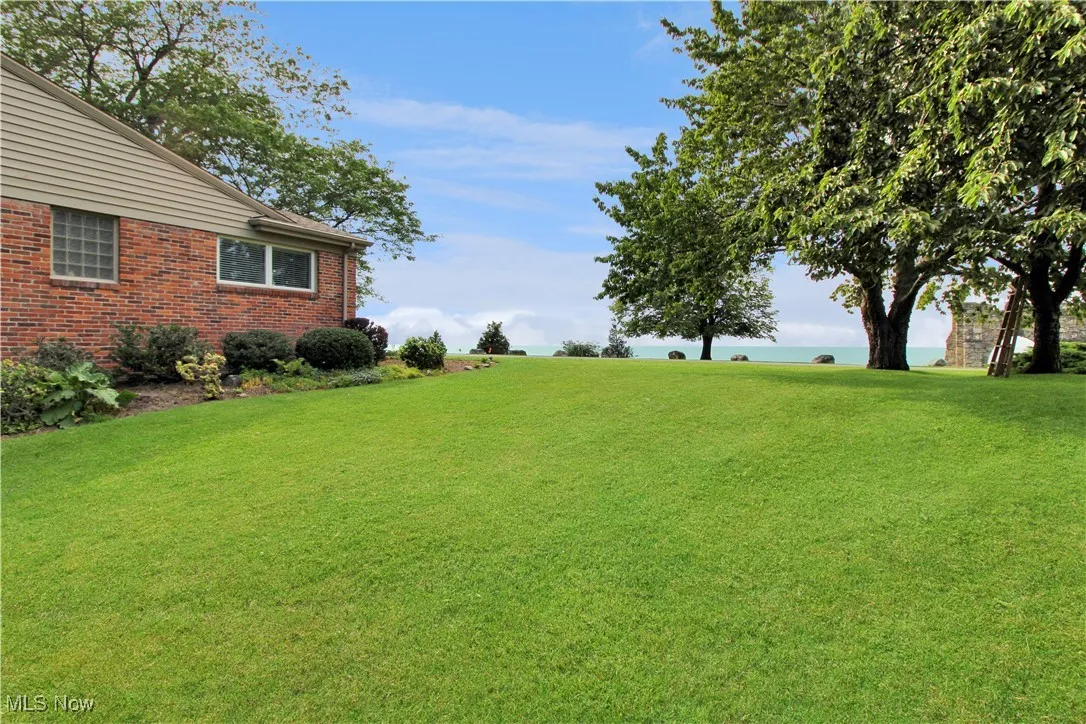 View of grassy yard featuring a water view
