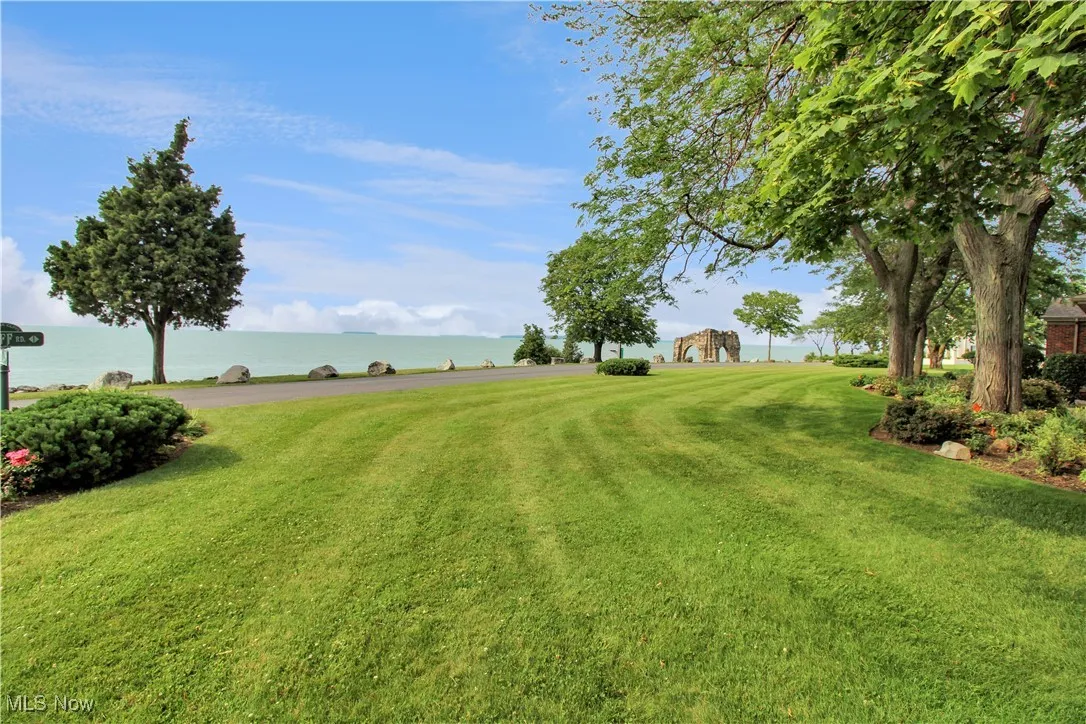 View of grassy yard featuring a water view