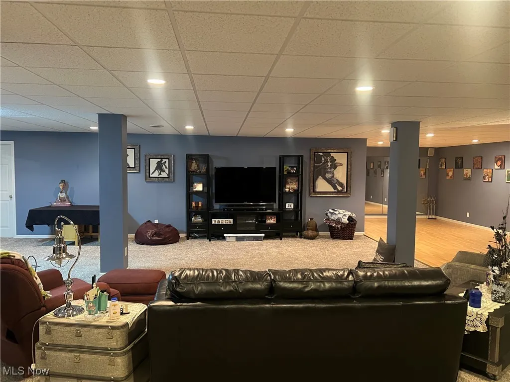 Living area featuring carpet and recessed lighting