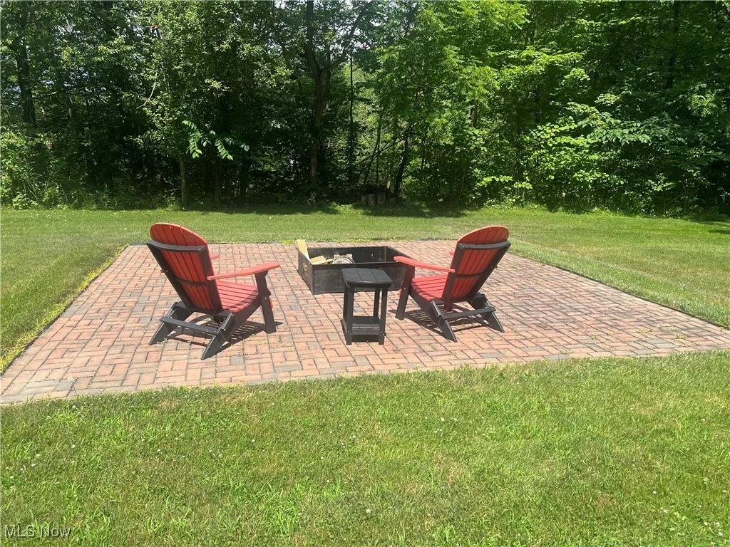 View of patio / terrace featuring an outdoor fire pit