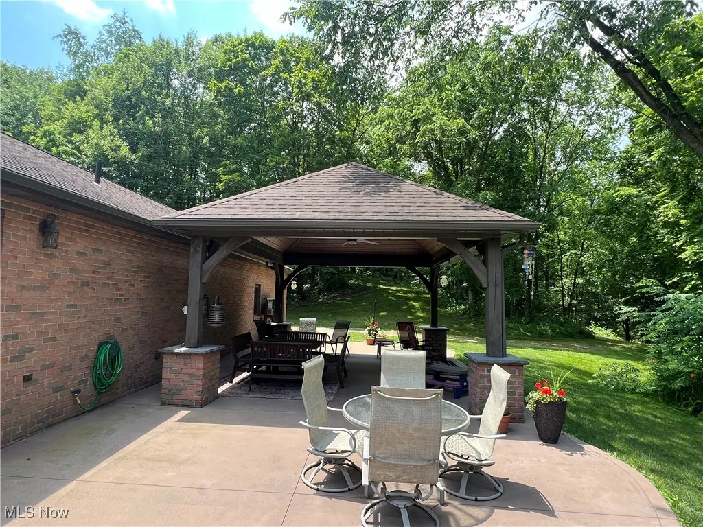 View of patio / terrace with outdoor dining space and a gazebo