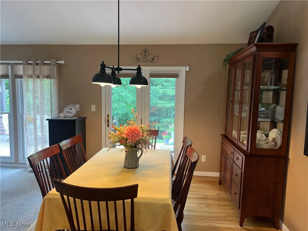 Dining room featuring baseboards and light wood-style flooring