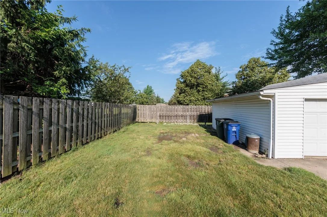 View of yard featuring a garage
