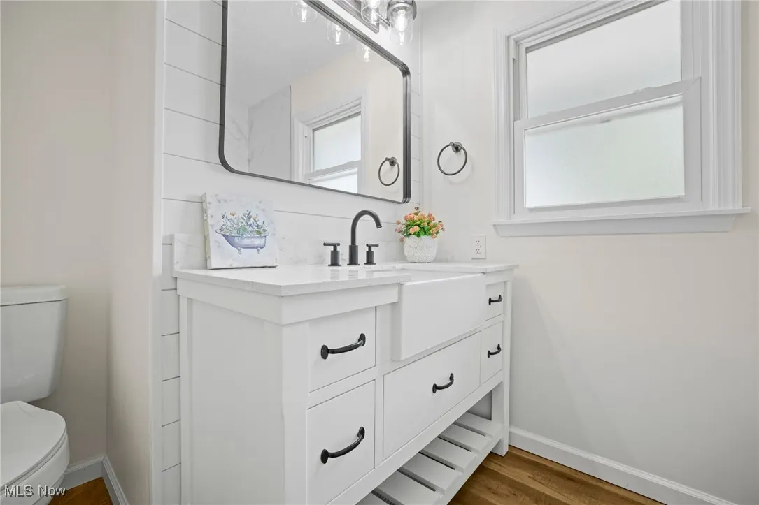 Bathroom featuring vanity and wood finished floors