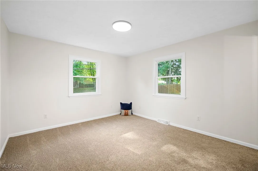 Spare room with carpet flooring and​​‌​​​​‌​​‌‌​‌‌​​​‌‌​‌​‌​‌​​​‌​​ baseboards