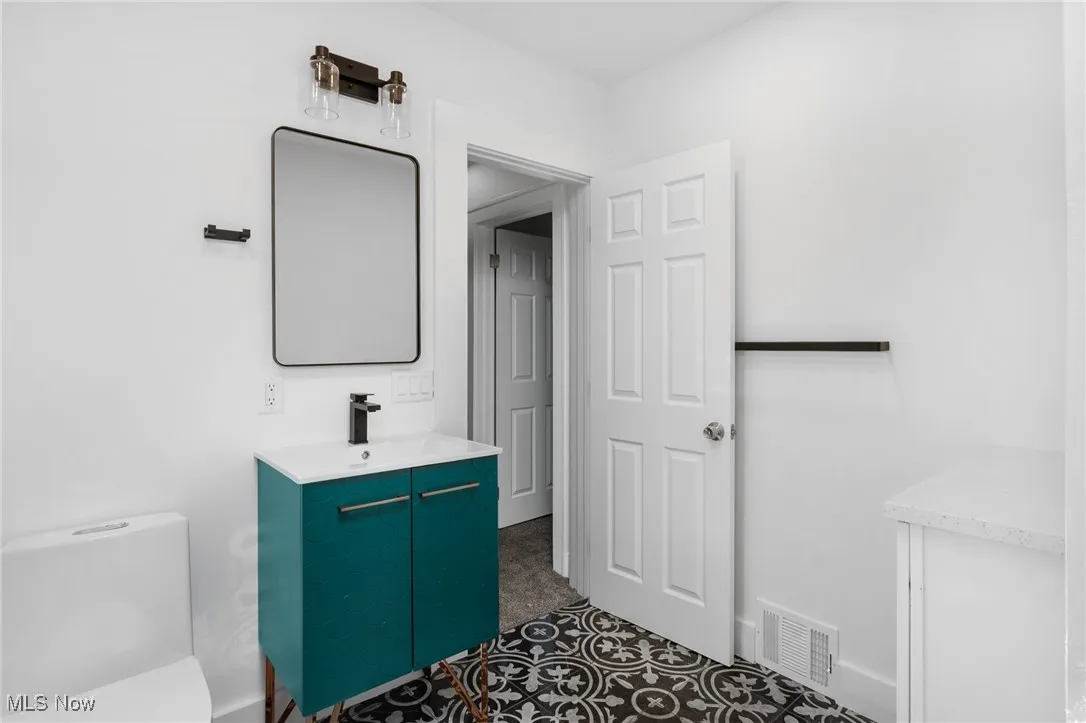 Bathroom featuring toilet and vanity