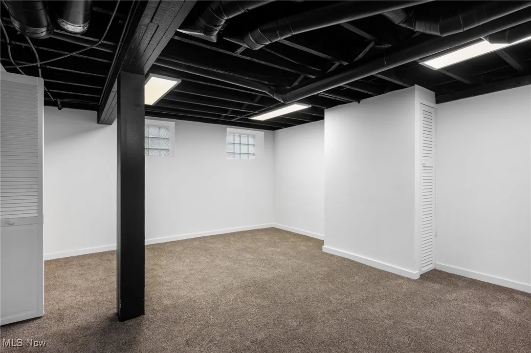 Basement with carpet flooring and baseboards
