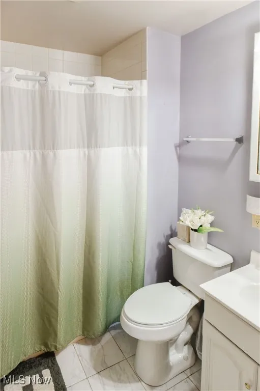 Bathroom with vanity and a shower with curtain