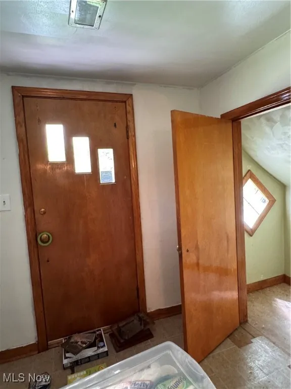 Foyer featuring baseboards