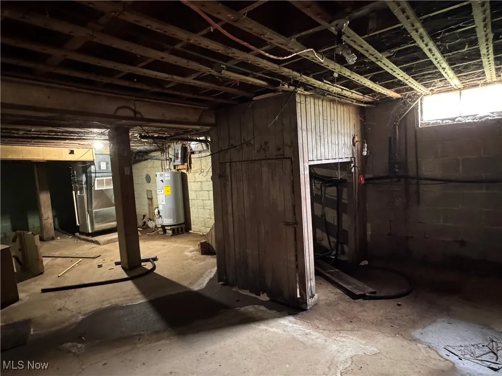 Unfinished basement with water heater