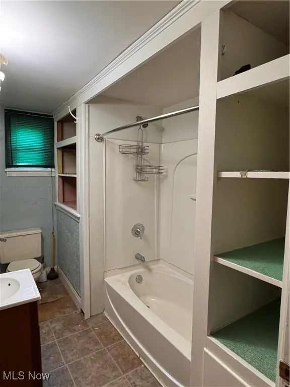 Full bathroom featuring tub / shower combination and vanity