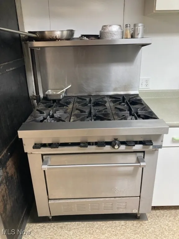 Kitchen view of stainless steel gas stove