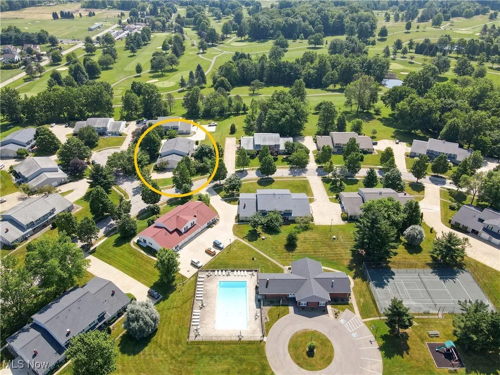 Aerial perspective of suburban area featuring a pool area
