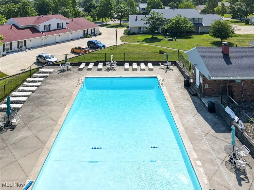 Community pool featuring a patio
