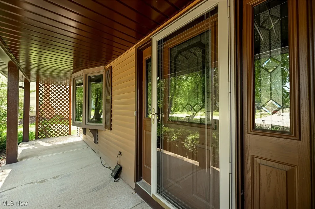 View of front entry featuring a porch