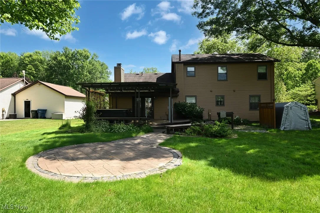 Rear view of property with a patio area and a deck