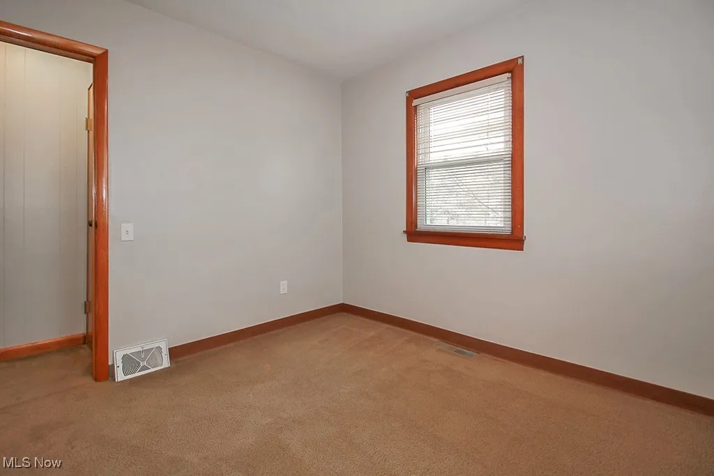 Spare room with light carpet