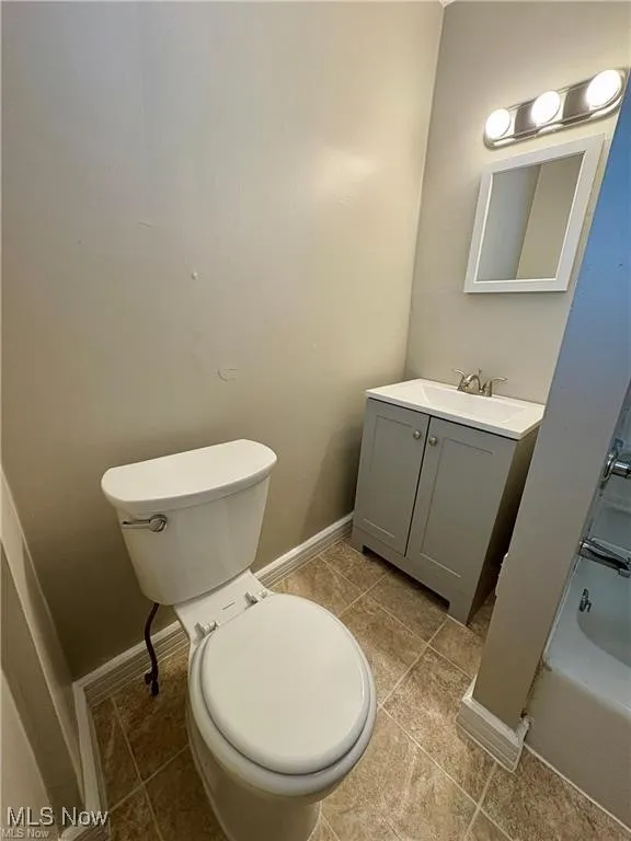 Bathroom featuring vanity and tile patterned floors