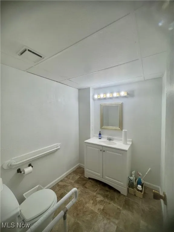 Bathroom with vanity and toilet
