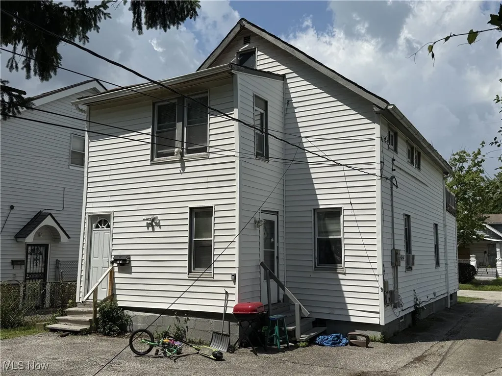 Rear view of house with entry steps