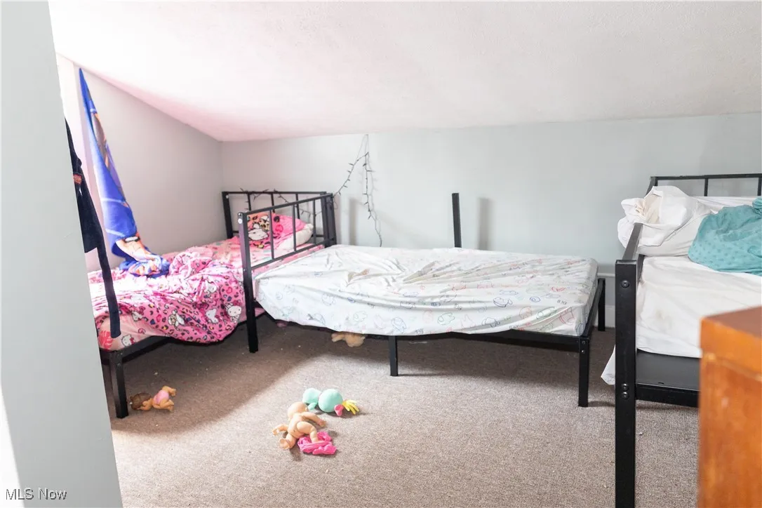 Bedroom featuring carpet flooring