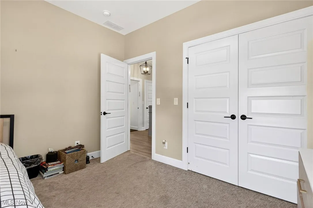 Bedroom featuring carpet floors and a closet