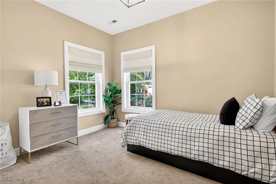Carpeted bedroom with baseboards